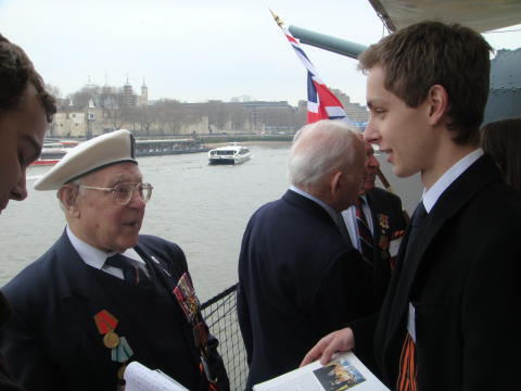 Gordon and Charles Downs chatting with the relatives of the veterans on board HMS Belfast in June 2012