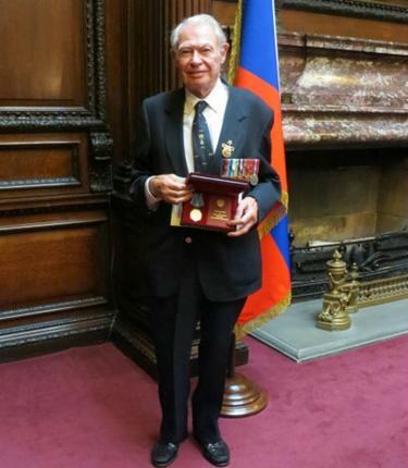 Ned Ruffle receiving his Ushakov medal