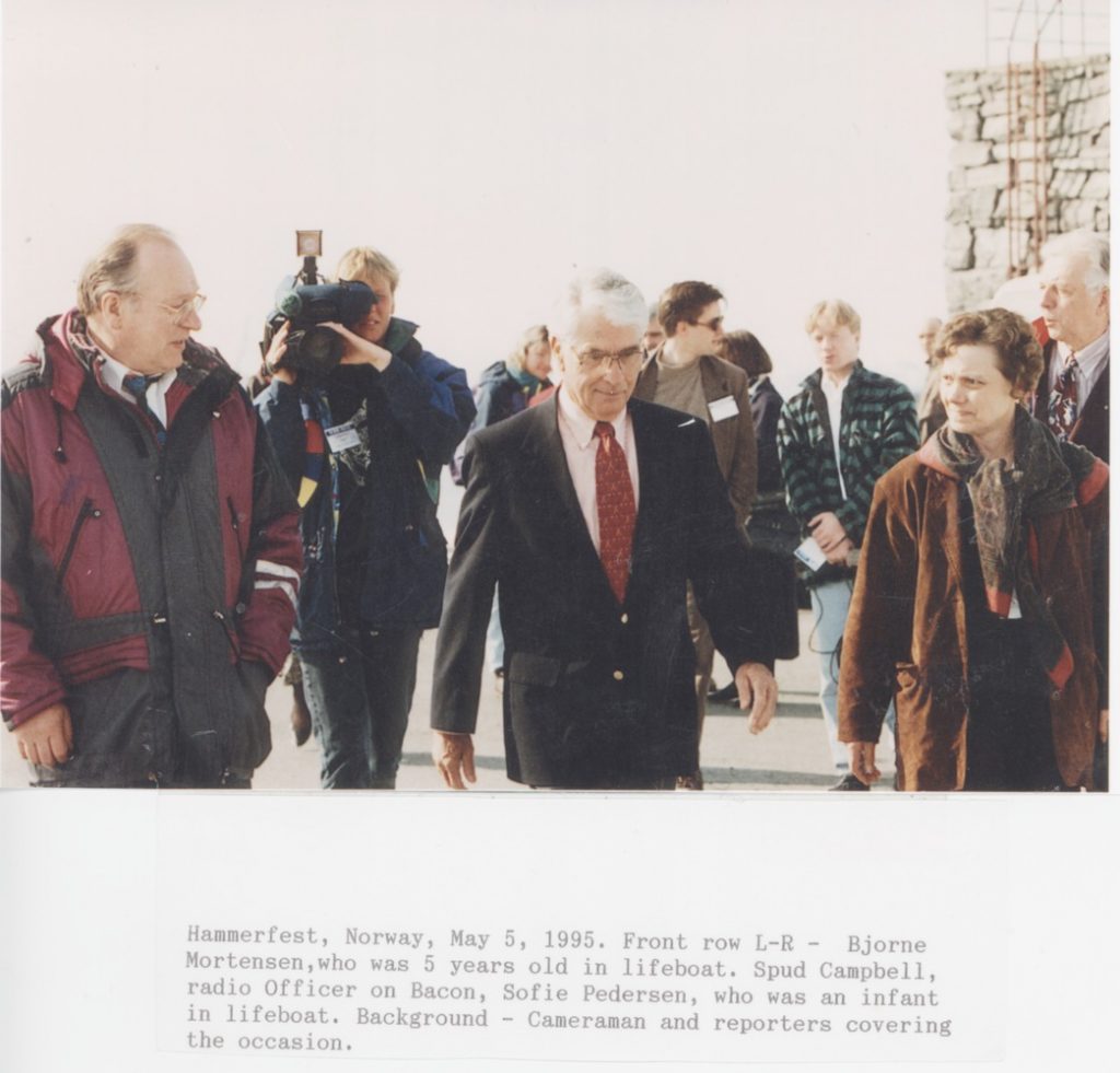 Hammerfest, Norway, 5 May, 1995. Front row L-R: Bjorne Mortensen, who was years old in lifeboat. Spud Campbell, radio officer on Bacon, Sofie Pedersen, who was an infant in lifeboat.
