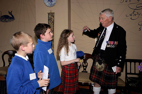 Veterans Jock Dempster and Jimmy McHugh talk to local school children in Poolewe