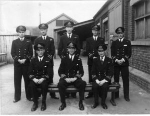 Latterly, Lieutenant A H Harvey seen centre back with officers from HMS Grecian.
